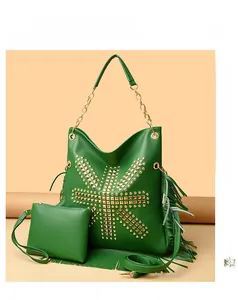 Detail of bright green fringe tote bag with golden rivets and matching small pouch