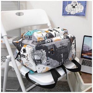 Detail of street-style graffiti backpack with geometric patterns and nylon straps