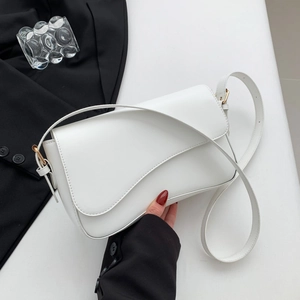 Minimalist white faux leather saddle bag with asymmetric curved flap and gold buckle