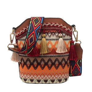Bohemian embroidered bucket bag with woven wide shoulder strap and colorful tassels