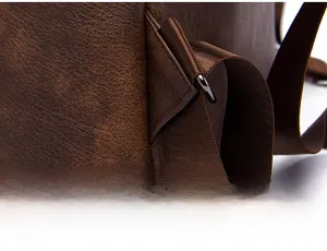 Detail showing reinforced triangular stitching on the bottom of the vintage leather backpack