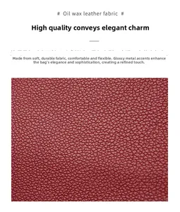 Detail of burgundy oil wax leather with lychee texture for crossbody shoulder bag