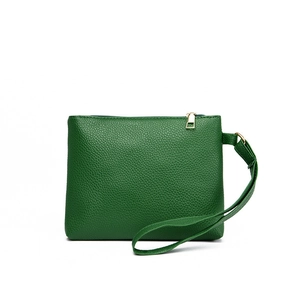 Close-up of green lychee pattern leather shoulder bag with golden zipper and rivets