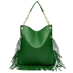 Detail of dark green leather shoulder bag with tassel fringe and gold chain strap