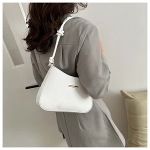 Elegant white leather shoulder bag with gold hardware detail and a chic knotted strap design