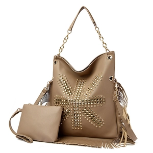 Brown faux leather tote with fringe tassels, gold studs, and matching pouch detail