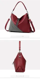 Detail of red pebbled leather tote bag featuring sparkly triangle rhinestone decoration