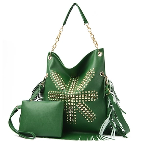 Detail of green punk rivet shoulder bag with long fringes and matching small pouch
