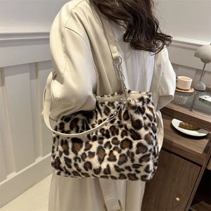 Fuzzy leopard print plush tote bag with cream leather straps and silver metal chain