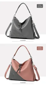 Detailed view of gray and pink crossbody bags with rhinestone panel and tassel zipper