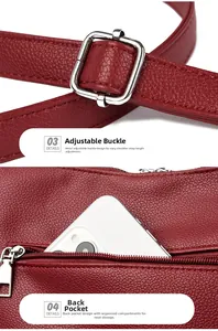 Detailed view of red pebble leather bag with silver buckle and phone zip pocket