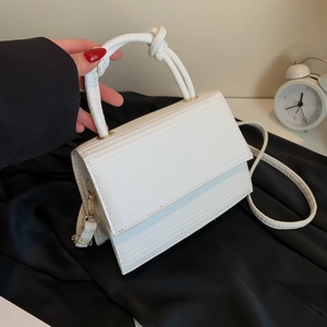 White woven texture crossbody bag with unique knot handle and minimalist square shape