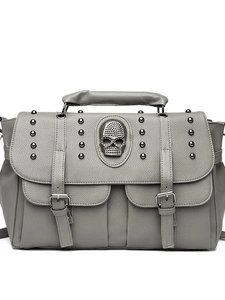 Grey punk handbag with skull emblem and metal studs on litchi grain faux leather