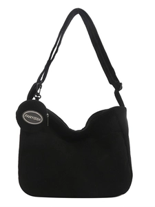 Minimalist black corduroy crescent crossbody bag with matching round coin purse detail