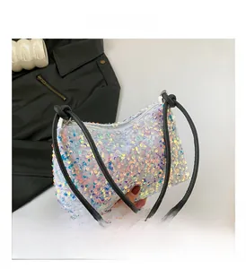 Close-up of colorful iridescent sequins and silver hardware on a fashion shoulder bag