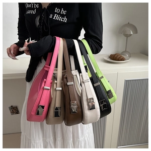 Close-up of minimalist half-moon bags in six colors with metallic buckle and soft PU leather