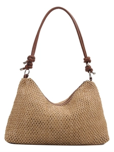 Fashionable woven straw tote bag with brown knot straps and silver metal rings