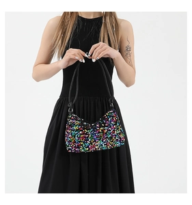 Detailed view of a sequined baguette bag showing vibrant multicolored glitter texture
