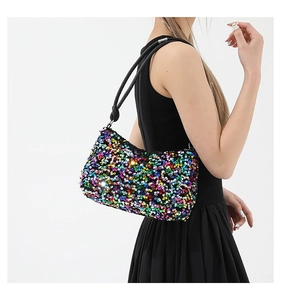 Close-up of vibrant iridescent sequin shoulder bag showing colorful texture and details