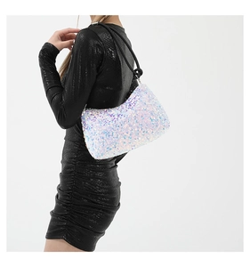 Chic sequined shoulder bag with black woven rope strap shown on a black dress model