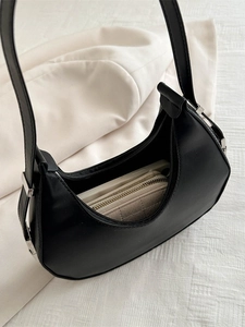 Minimalist black crescent hobo bag for women with interior view showing storage capacity