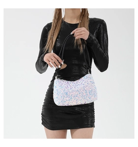 Detail of sequin shoulder bag with lilac and white sequins and black woven strap