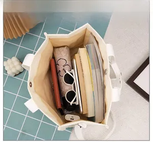 Interior view of large corduroy tote bag showing spacious capacity and magnetic closure