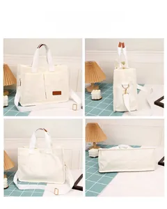 Detail view of cream corduroy tote bag showing front pockets and detachable strap