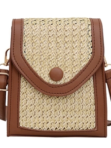 Bohemian straw woven crossbody bag with brown leather trim and metallic chain strap