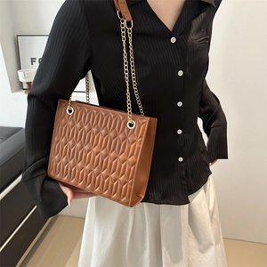 Brown quilted chain shoulder bag with 3D geometric texture and gold straps for women