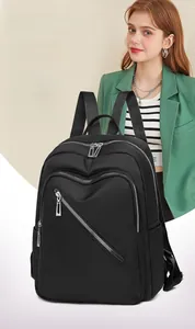 Close-up of waterproof nylon backpack with smooth diagonal zipper and silver metal hardware