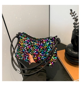 Macro detail of vibrant multi-colored sequin handbag with secure top zipper closure