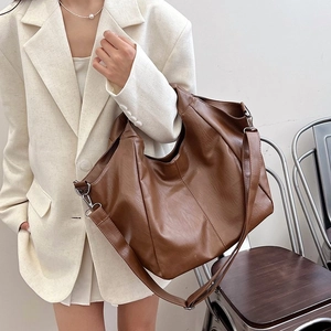 Brown oversized Hobo shoulder bag with soft pleated texture for daily commute or casual use