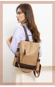 Detail view of khaki woven PU leather backpack with vintage design and anti-theft zipper