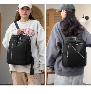 Lighweight black nylon backpack for women with adjustable straps and multiple pockets