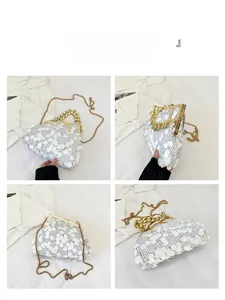 Detailed views of a white sequined clutch with gold chain handles and retro metal clasp
