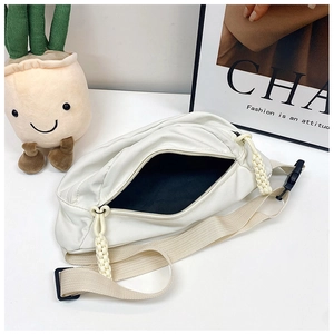 Top view of white casual belt bag with cream braided rope zipper and black buckle