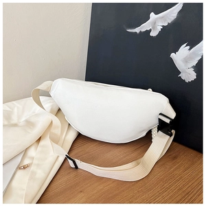 Detail of white half-moon waist bag with adjustable canvas strap on a neutral background