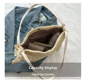 Top view of large capacity straw tote bag showing phone, wallet and umbrella inside