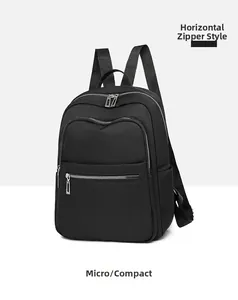 Side view of black nylon backpack featuring waterproof zippers and side storage pocket