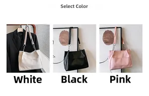 Detailed view of the large faux leather tote bag with metal chain straps in three colors
