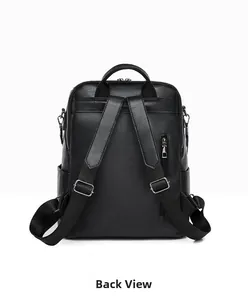 Detail view of the black leather backpack showing rear anti-theft zipper pocket