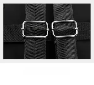 Detail of adjustable nylon shoulder straps with silver metal buckles on a black backpack