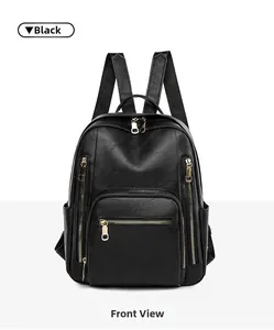 Detailed front view of black faux leather backpack with gold zippers and litchi texture