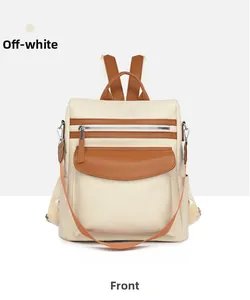 Front view of beige vintage backpack with brown leather details and multi-use straps