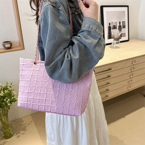 Chic pink waffle texture tote bag with golden chain strap for women casual daily wear