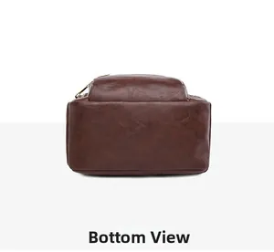 Detail view of the flat bottom structure and stitching of the dark brown leather backpack