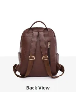 Detail view of the brown backpack back with litchi texture and anti-theft zipper pocket