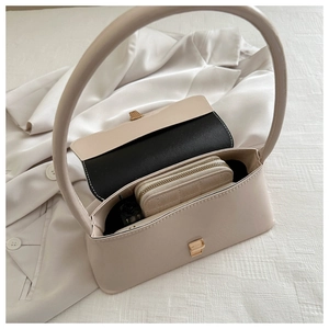 Top view of beige baguette bag interior showing capacity for wallet and essentials