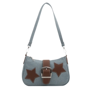 Trendy light blue denim shoulder bag with brown leather stars and silver chain detail